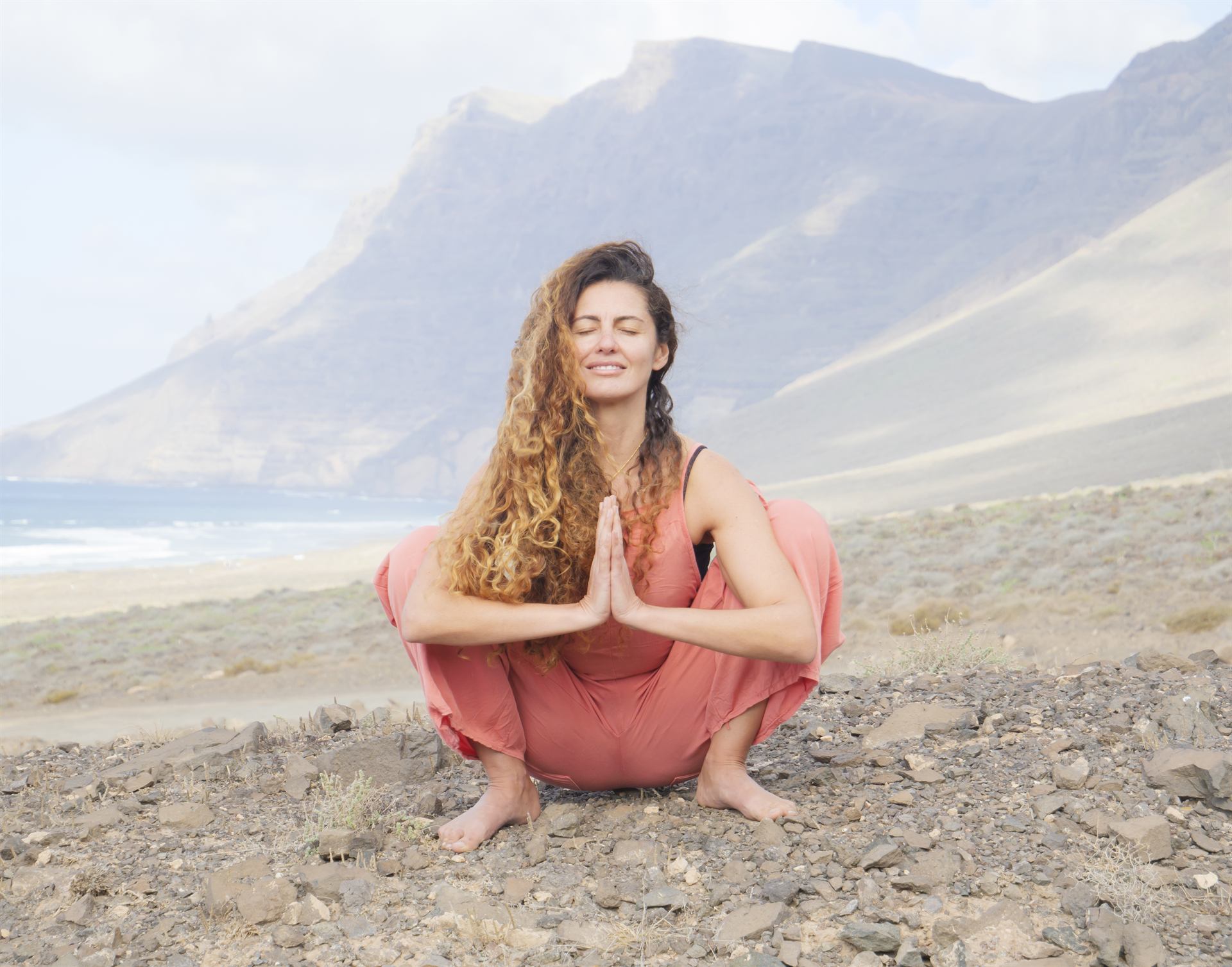 Seated side stretch by the sea